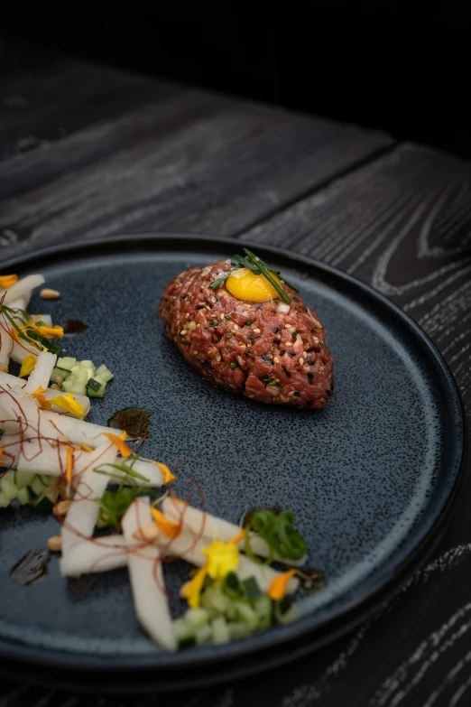 a plate with some vegetables on it on the table