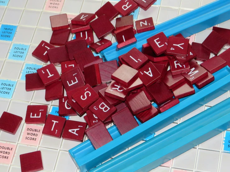 a blue blue toothbrush and many words on a white and blue tile