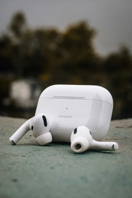 a small, white, modern looking device with two heads sitting on it's side