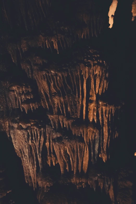 several layers of brown rock formation at night