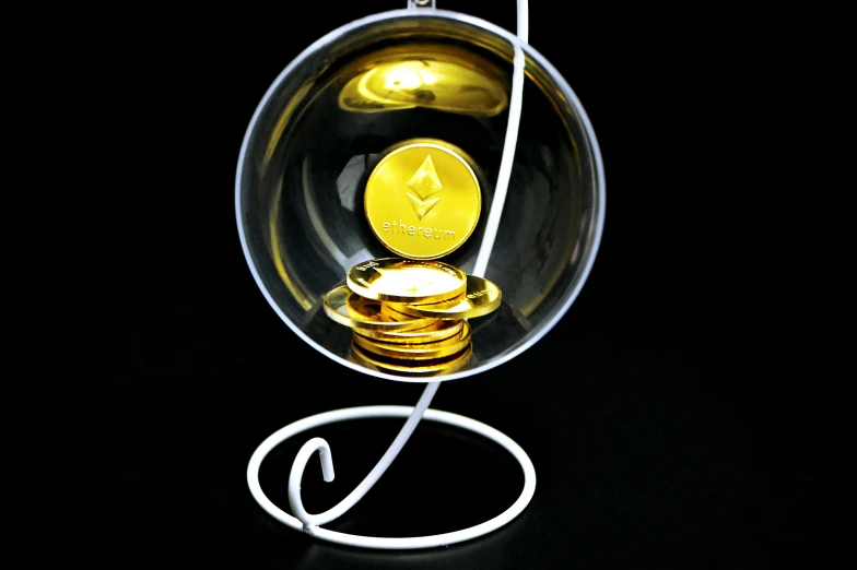a pair of ear buds sitting in front of a glass object