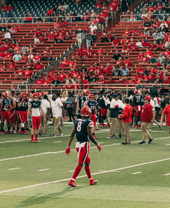 a football player on a field playing a game