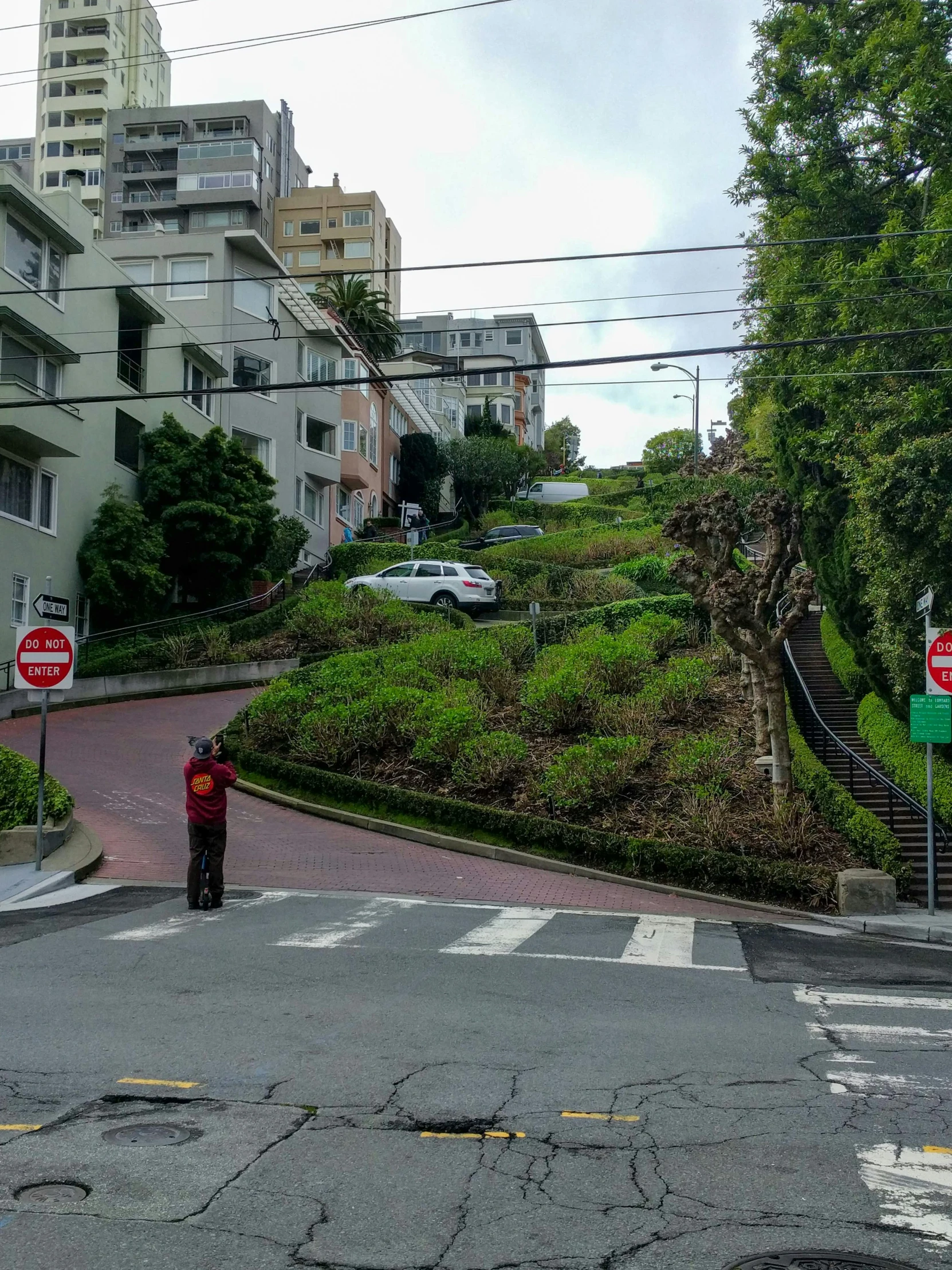 a man is standing at the intersection in front of a hill