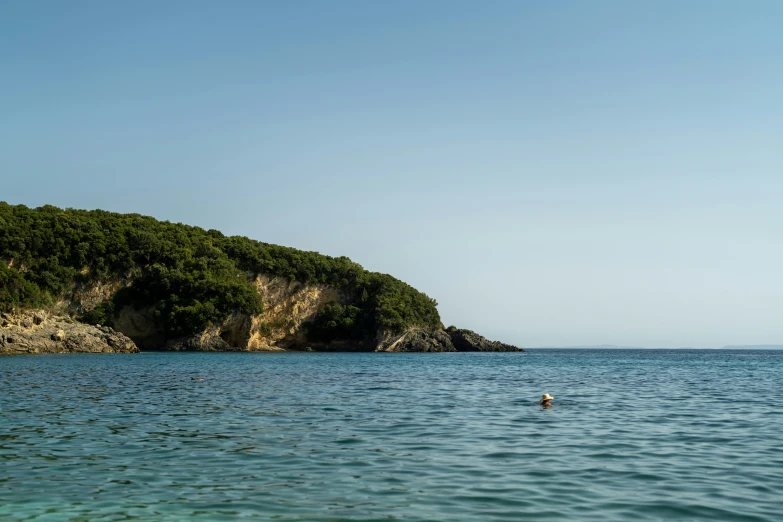 two people in the water at a beach