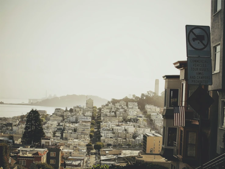 a city with tall buildings and a clock