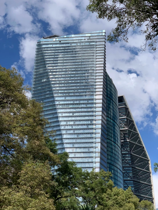 a large tower with trees around it