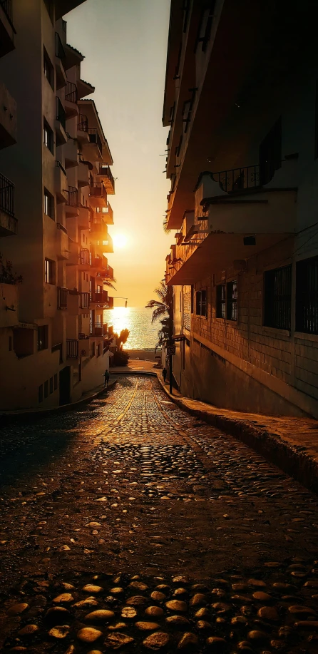 a long narrow road is in front of a building