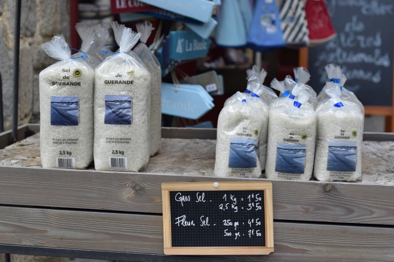 a display in a shop filled with bags of sand