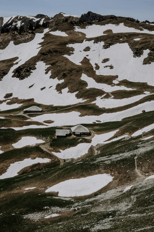 a couple of snow covered mountains on a clear day