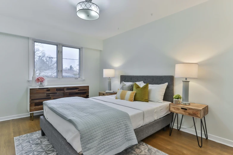 a big white bedroom with an airy feel