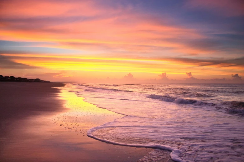 sunset over the beach in pink and blue