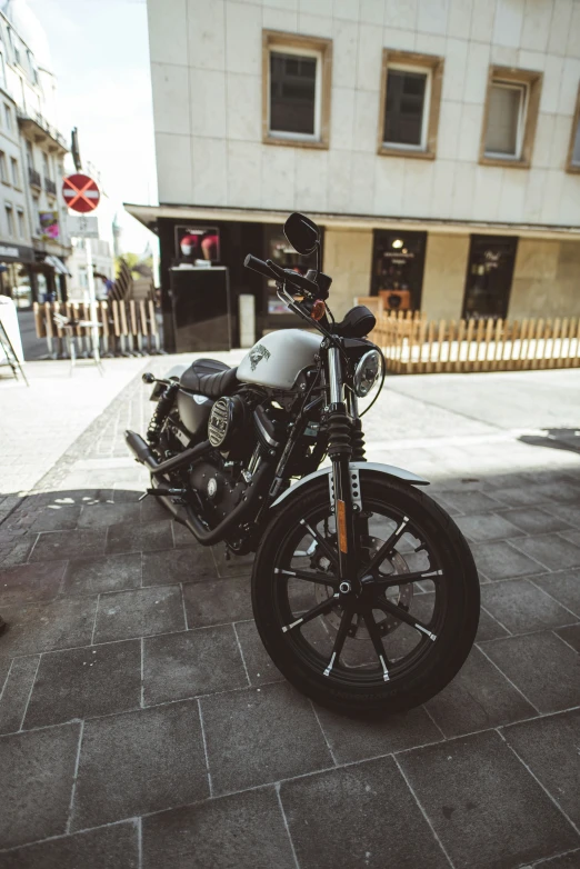 two motor bikes are on the side of the street