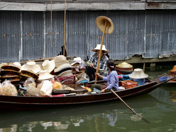 there is a small boat with people on it,