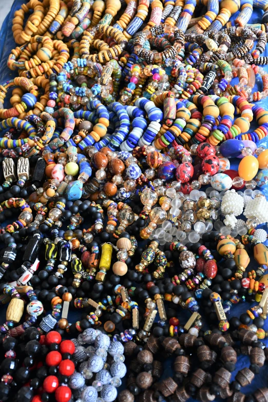 an artistic display of beaded, celets and charms