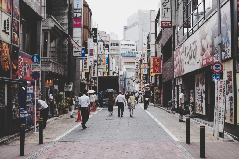 some people and buildings are shown from outside