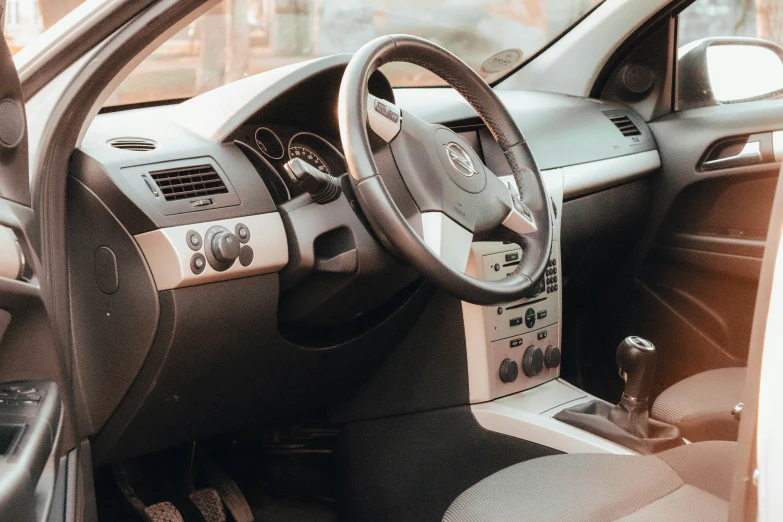 a dashboard and steering wheel inside a car