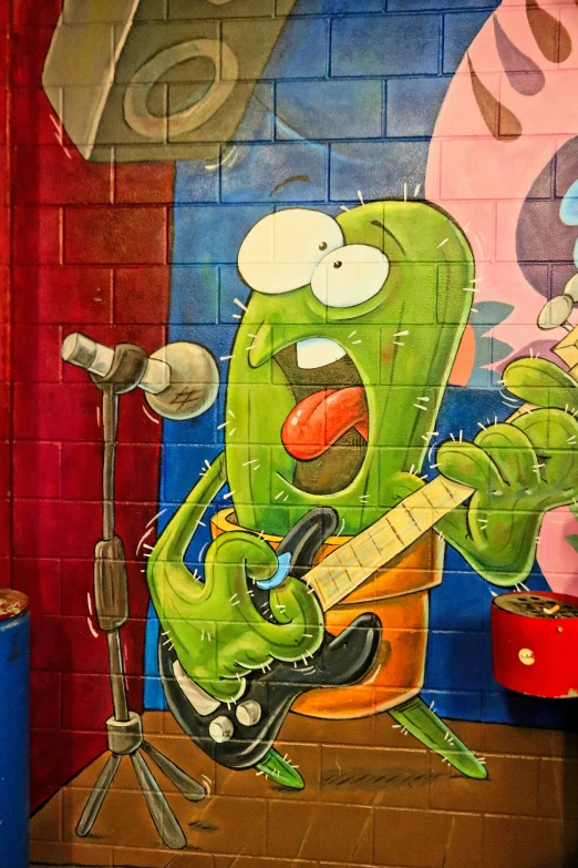 this painting depicts a green cartoon character playing a guitar