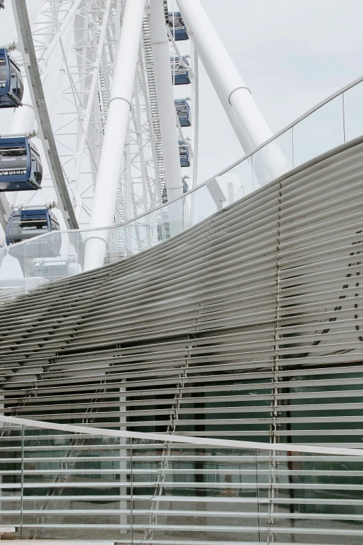 some cars are driving on the top of a bridge