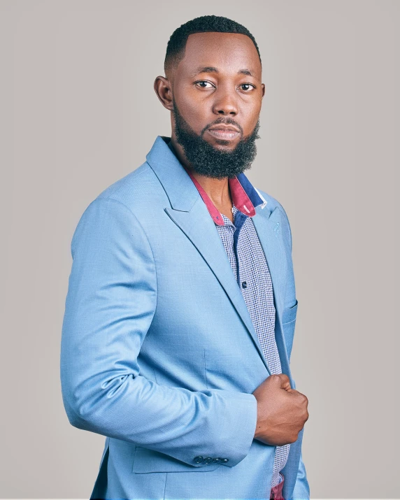 an african american male in a blue suit and tie