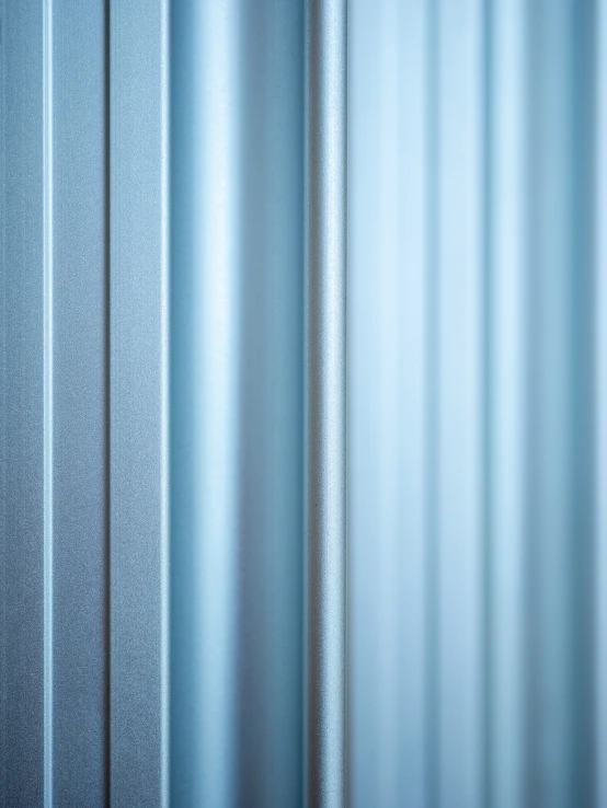 a room with curtains and some blue material on the curtain