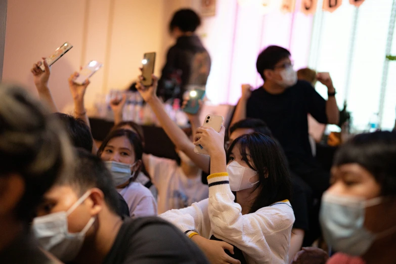 children at a public event, some with face masks