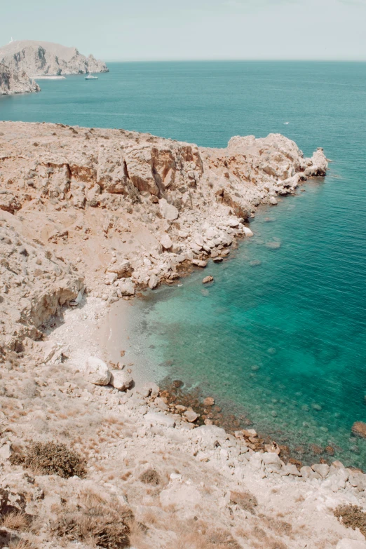 a boat is in a clear blue pool of water