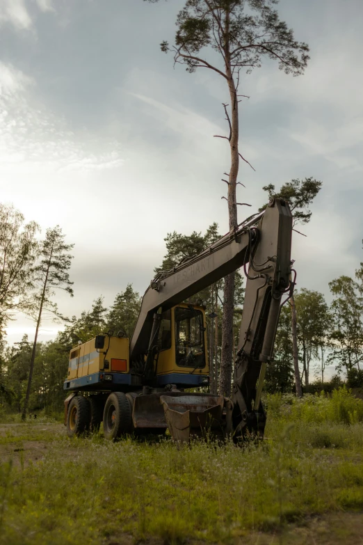 a tractor that is standing in the grass