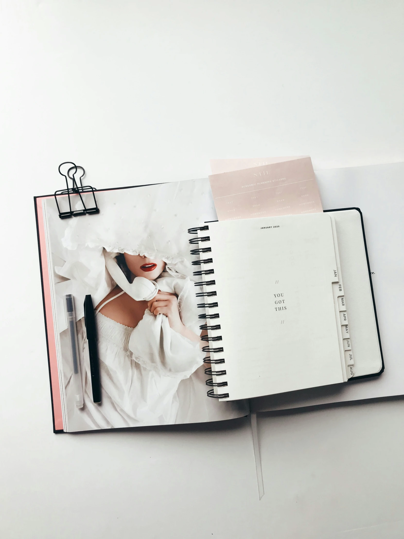 the pages in this book are open to show an image of someone sitting on top of a bed