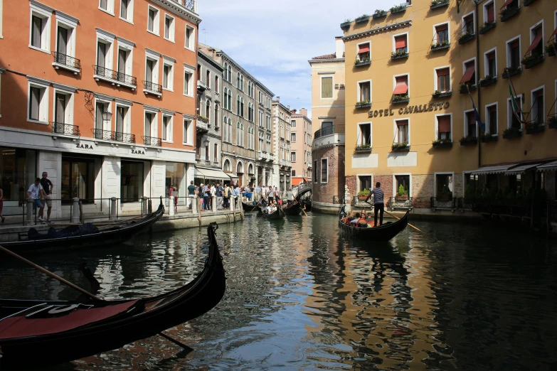 a waterway with buildings and boats in the middle of it