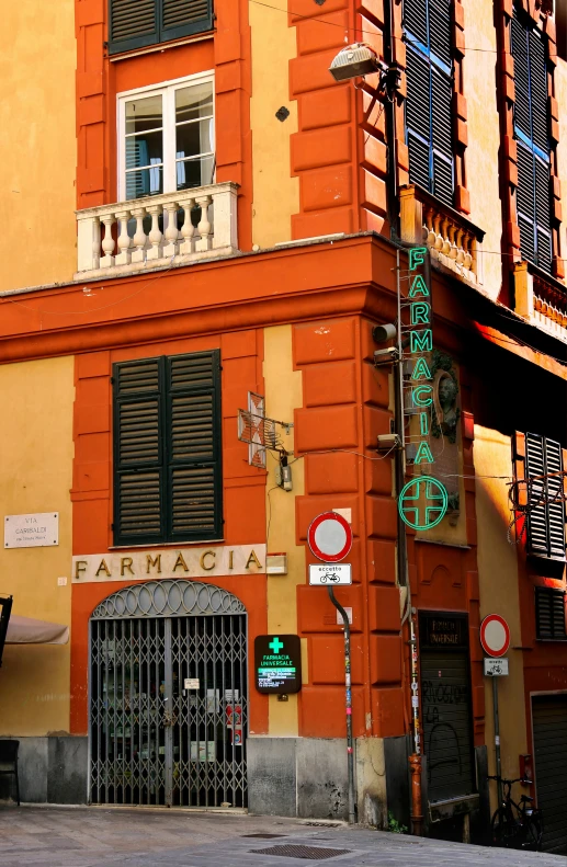 a red building with a green and white sign