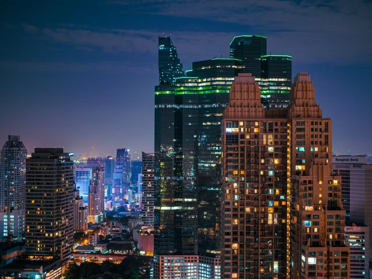 many tall buildings with lights at night