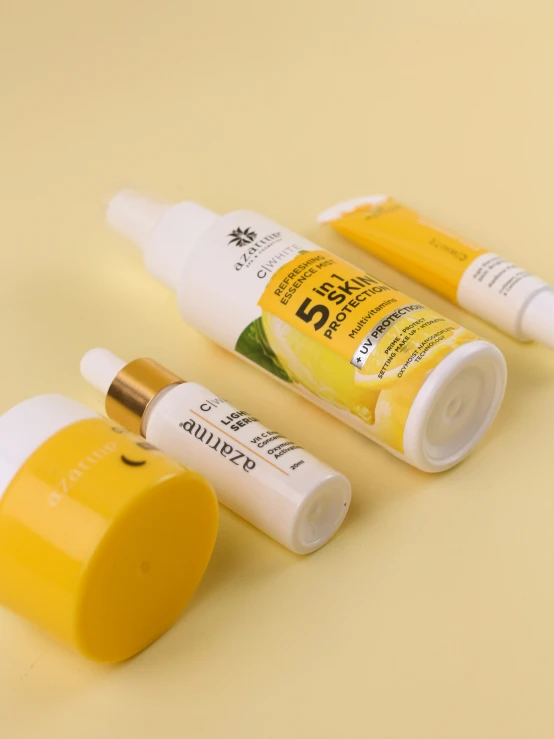 three yellow and white tubes with an yellow tube next to it
