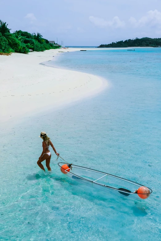 the woman is trying to move a water ski