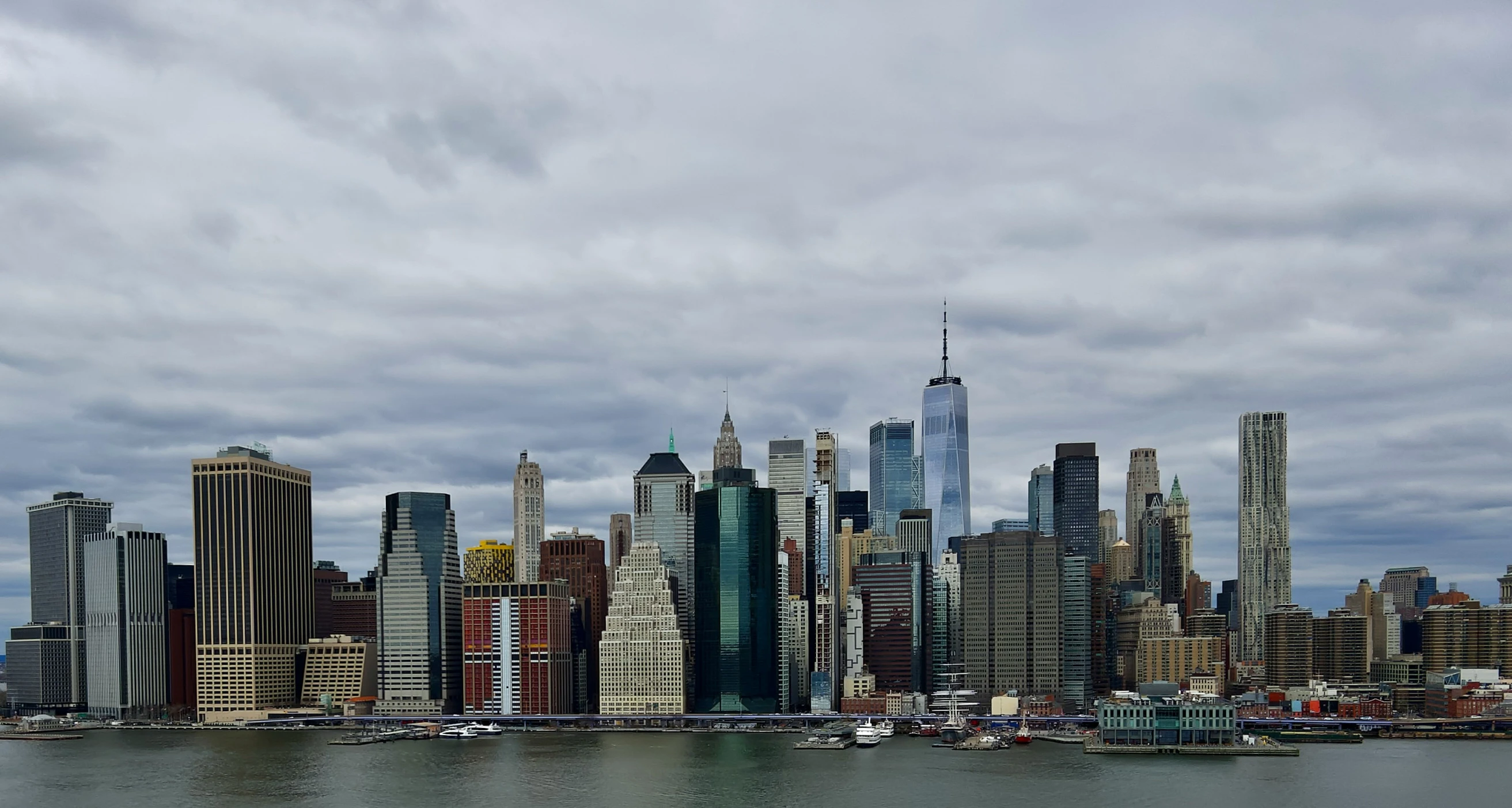 a view of some tall buildings in the water