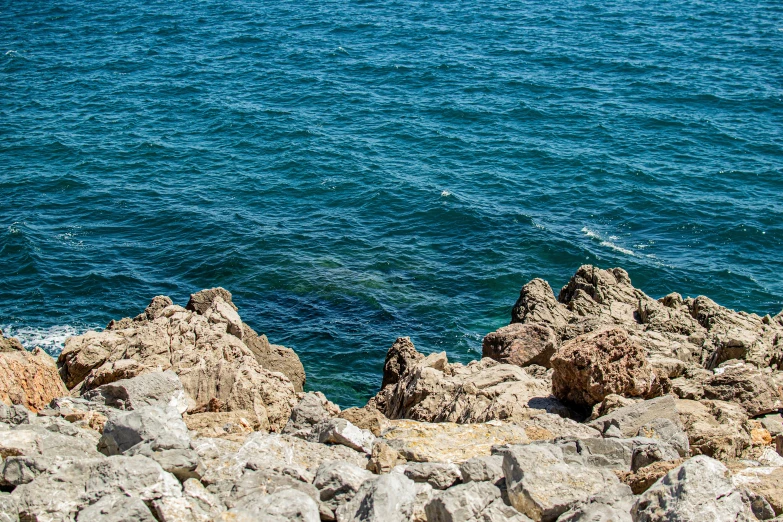 a rock pile overlooking a body of water