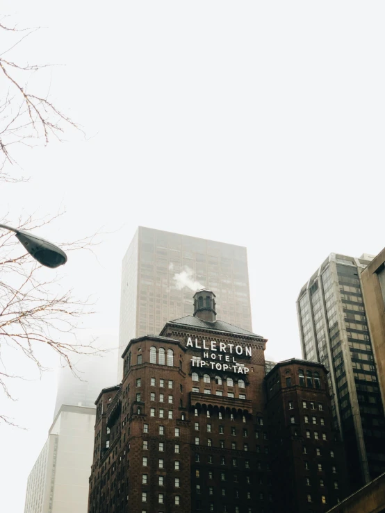 a tall brick building with a clock in it