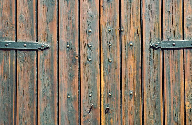 two wood doors that are next to each other