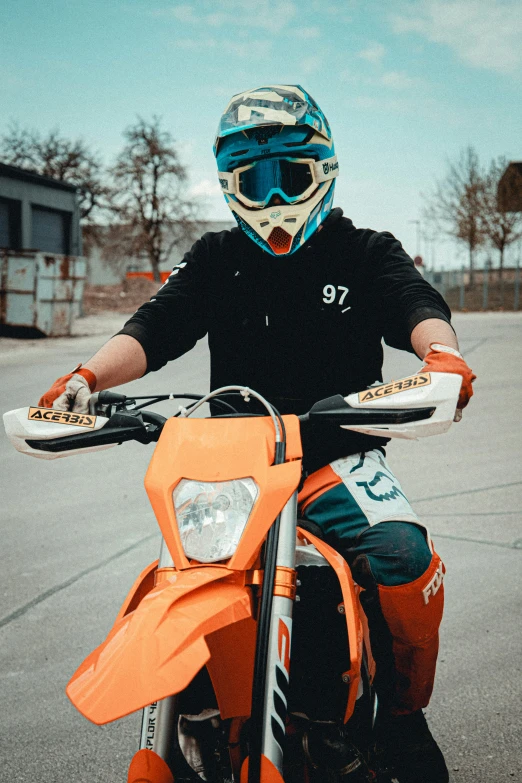 a man with a helmet and gloves on riding a motorcycle