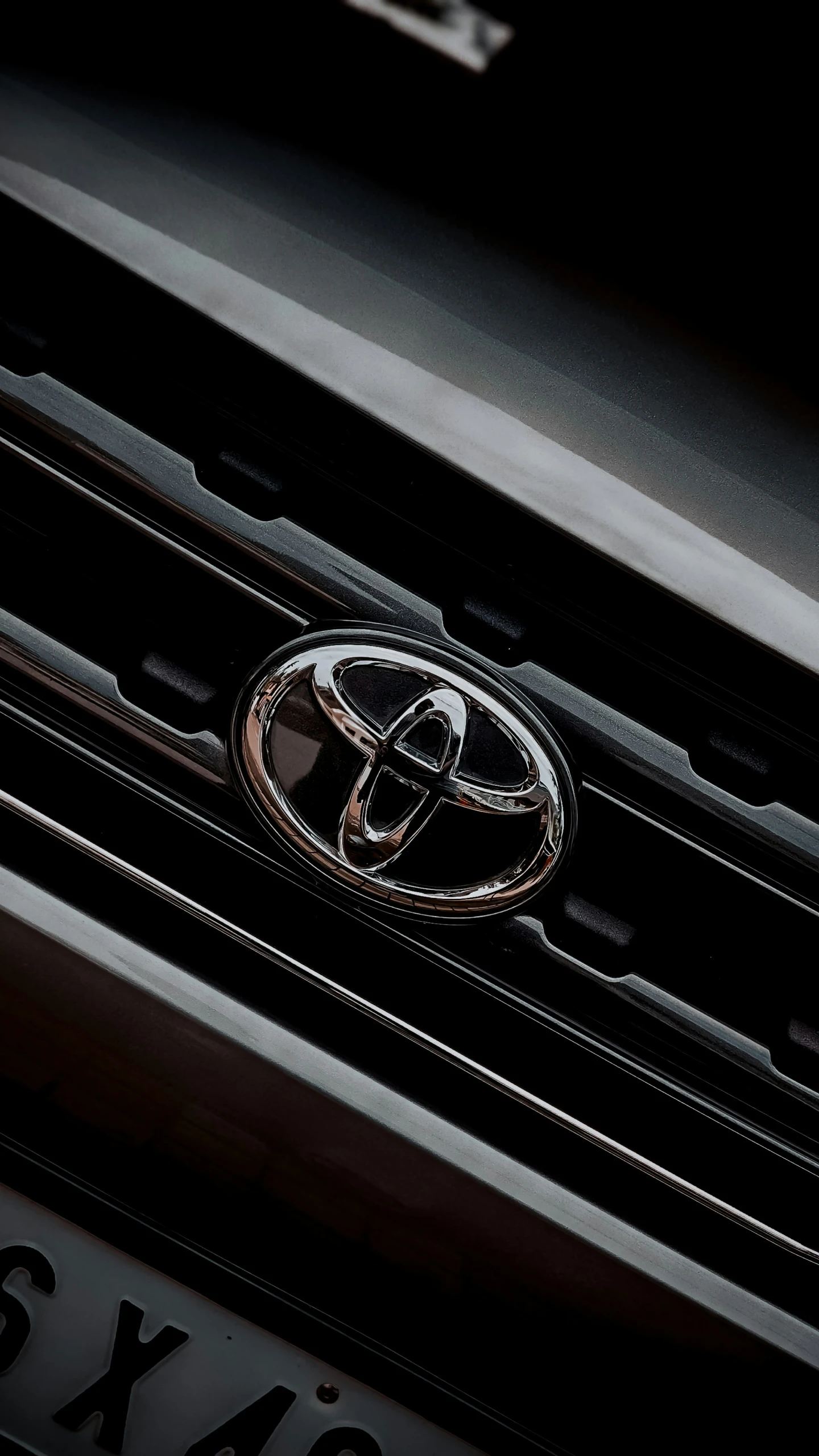 a black and white picture of the emblem on a toyota