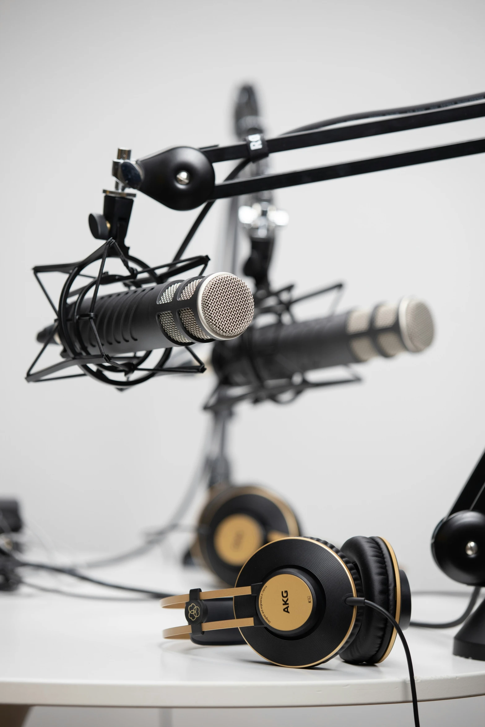 two microphones attached to a table in a recording studio