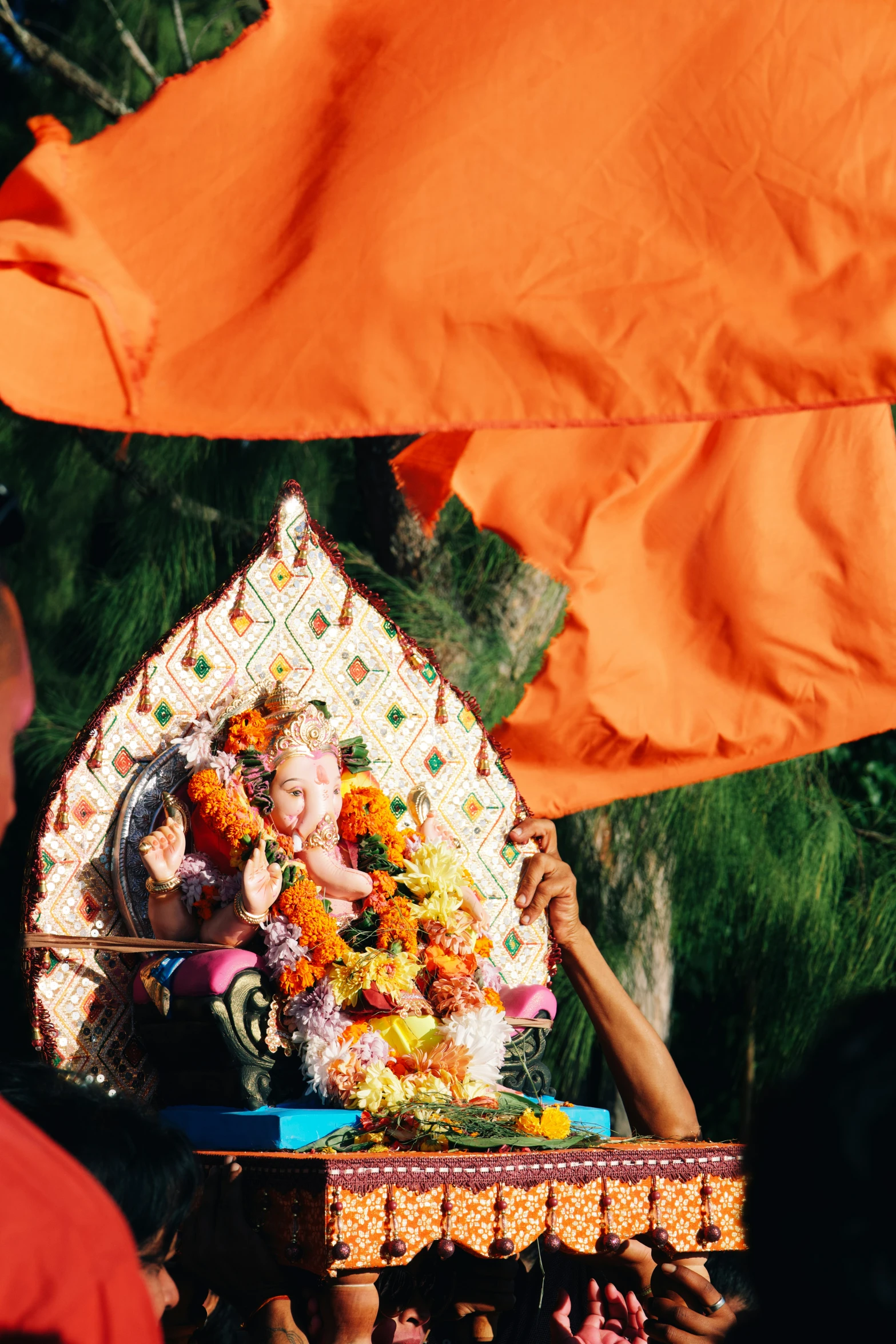 a group of people with flags and decorations in their hands