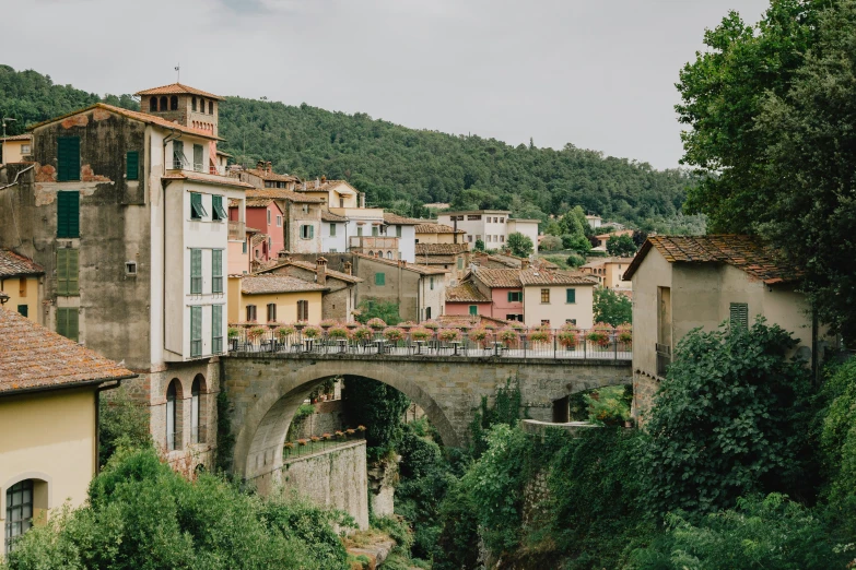 old village in mountains with a small bridge