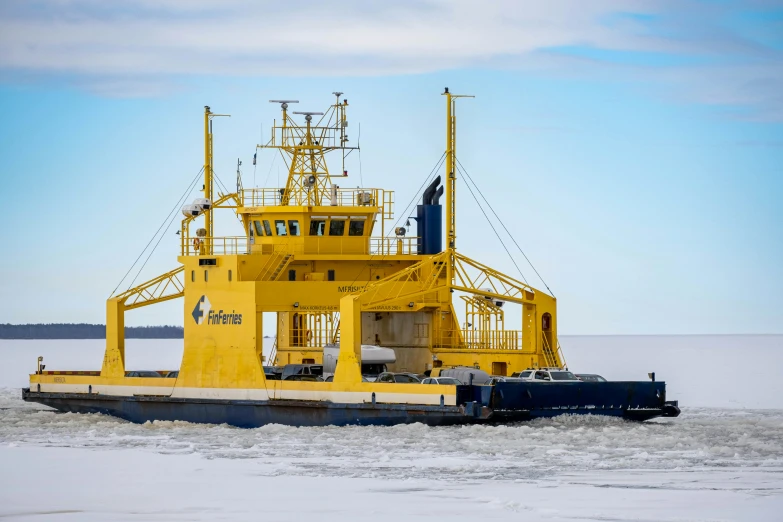 a boat is sailing across some ice with a blue object