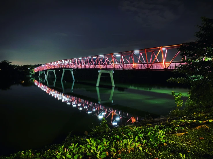 a long view of a bridge on a body of water