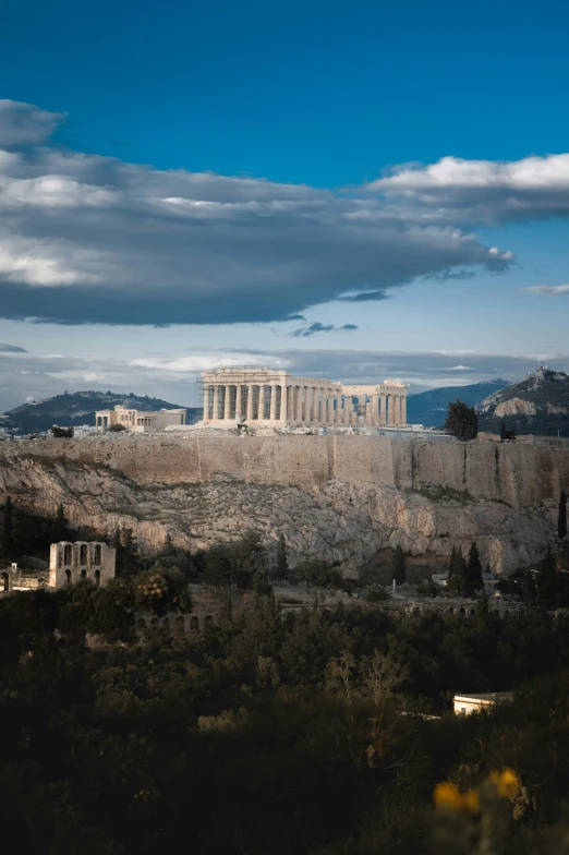 a view of the parthene temple from a hill above