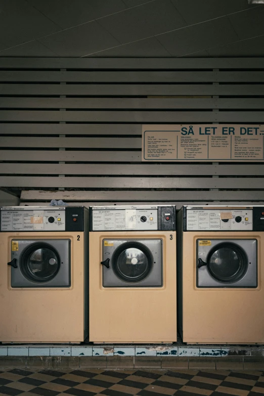 washers are stacked up in a row on the floor