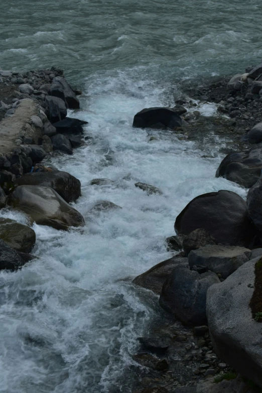 the water is very rough and rushing between the rocks