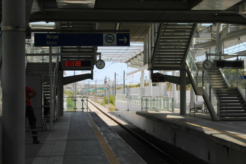 a train station with a lot of escalators