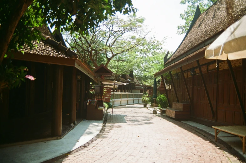 small street lined with wooden buildings in asian village