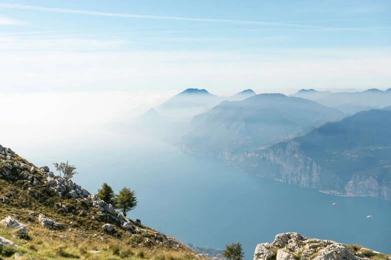 a man stands at the edge of a mountain